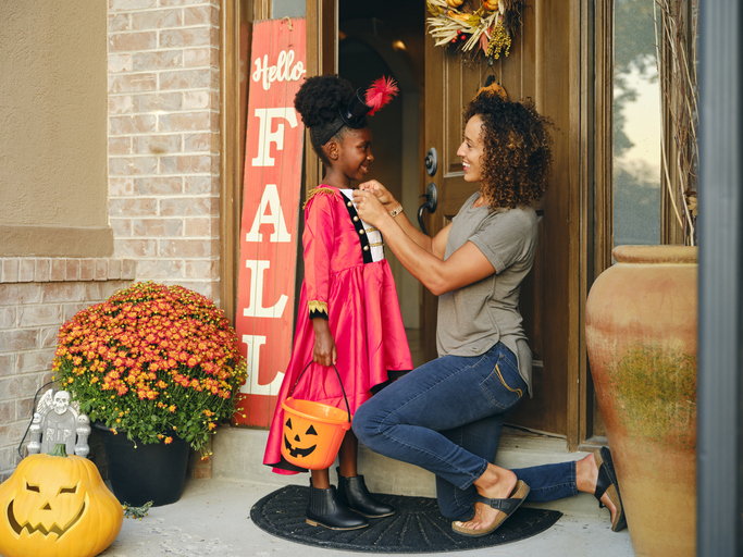 mother and daughter preparing for Halloween