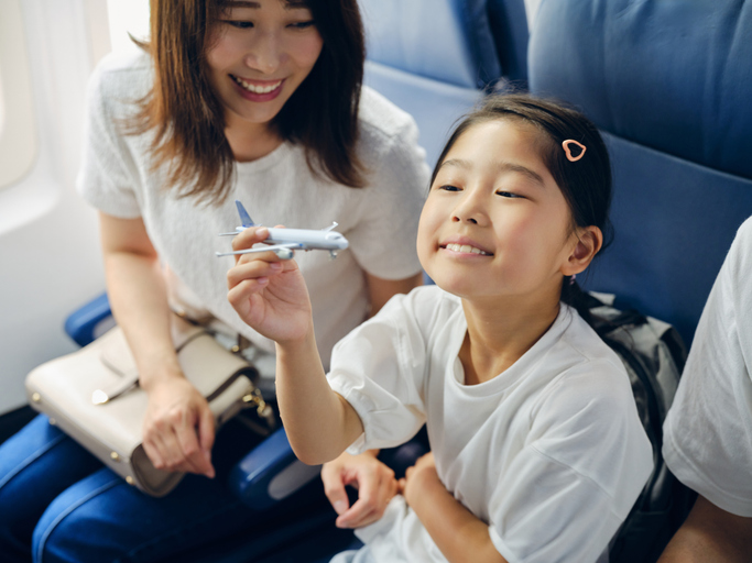 mother and daughter on an airplane